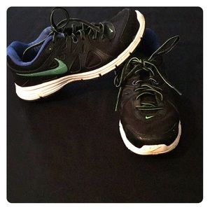 Black, neon green, and blue Nike’s
